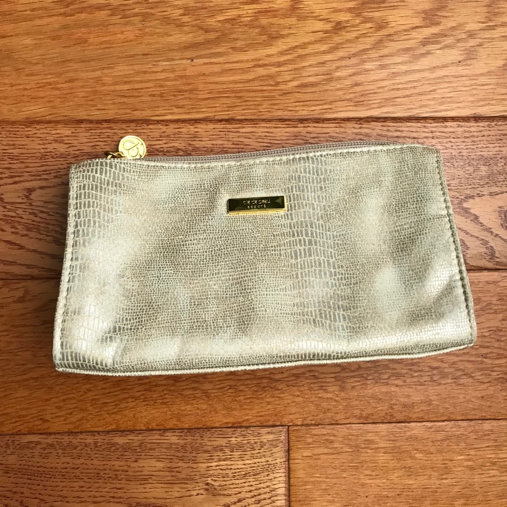 cle de peau small gold cosmetic bag